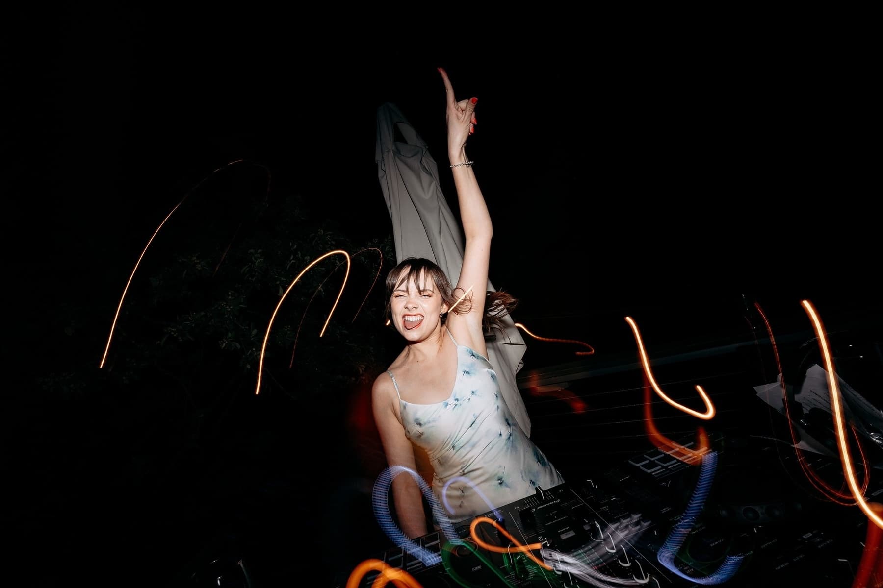 Jasmine DJing with the dance floor lit up