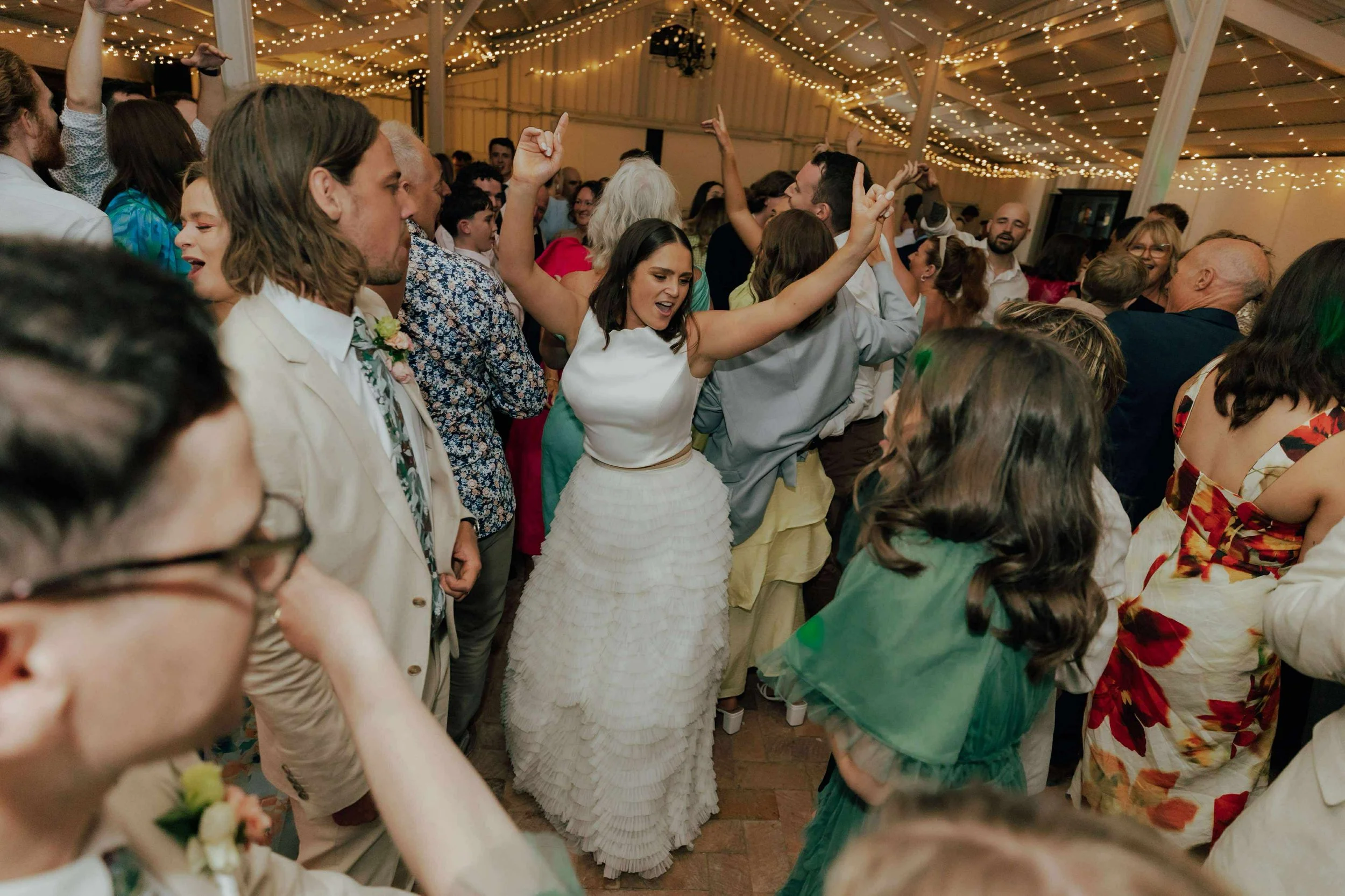 Bride arms up in the crowd